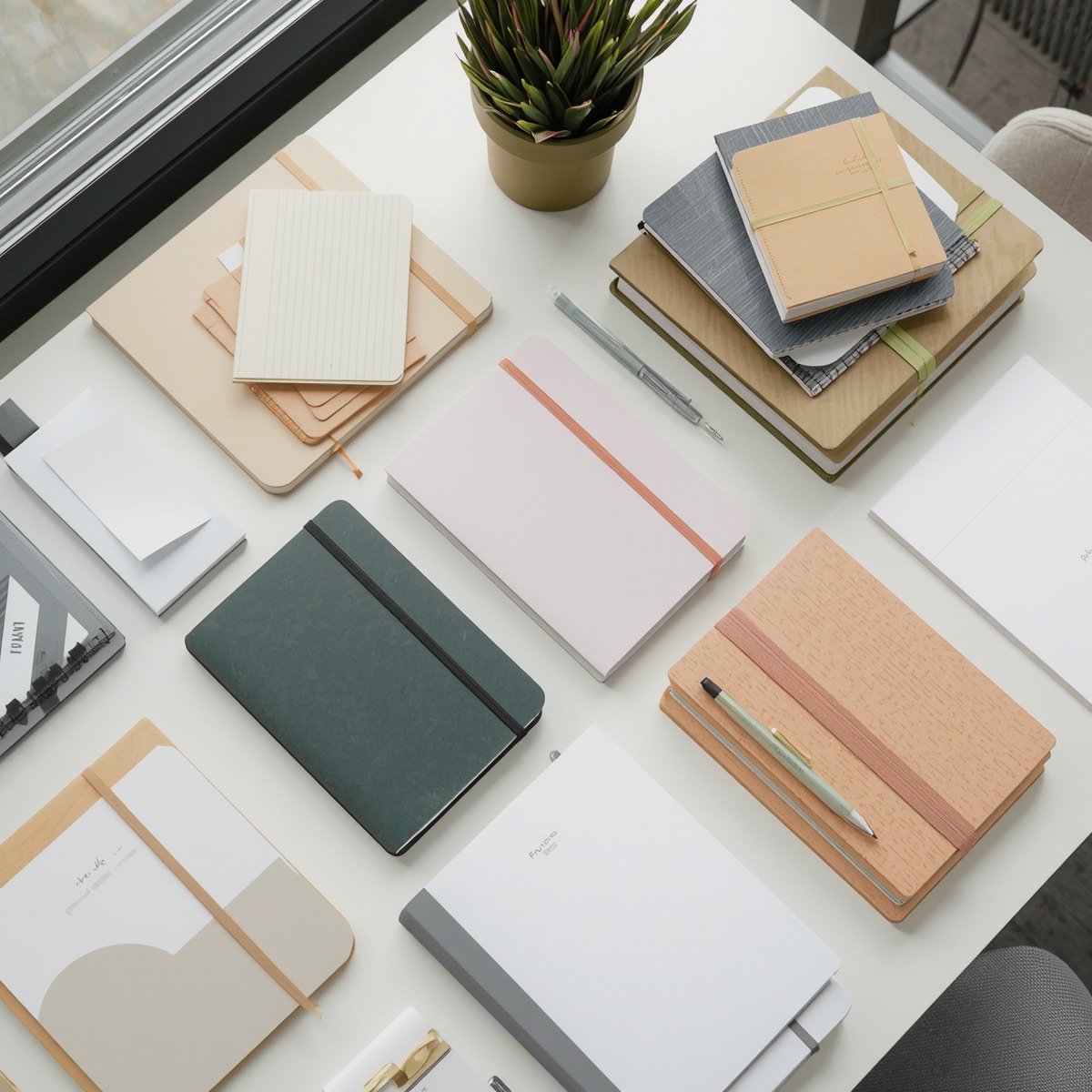 Organised office desk with stationery